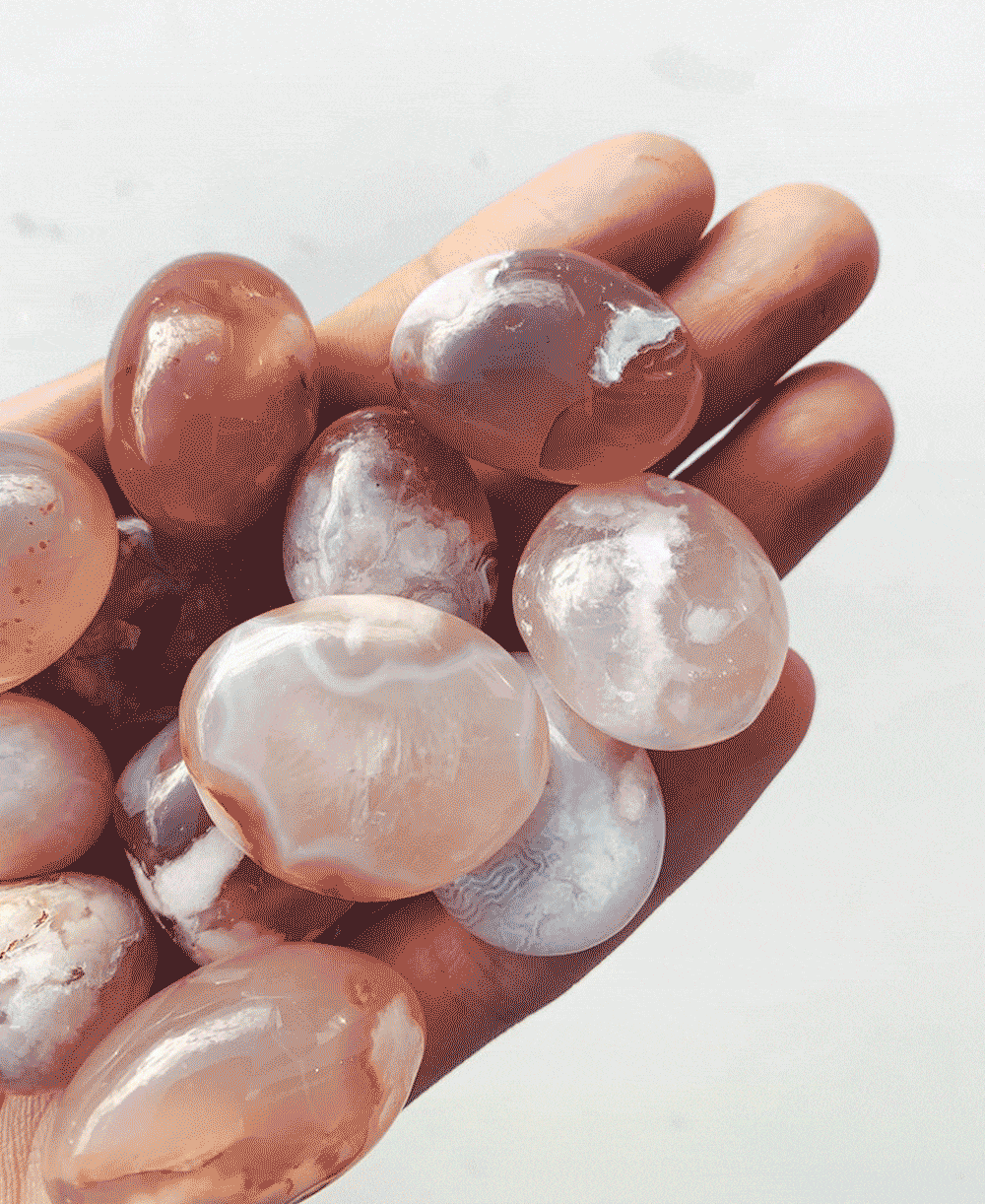 Tumbled Crystals in a hand GIF