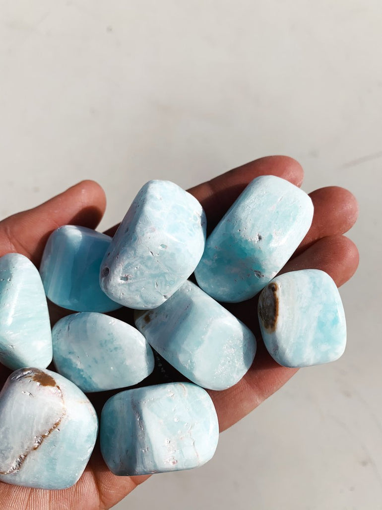 CLEANSE & CO. Caribbean Calcite. Ethically Sourced Tumbled Crystal.