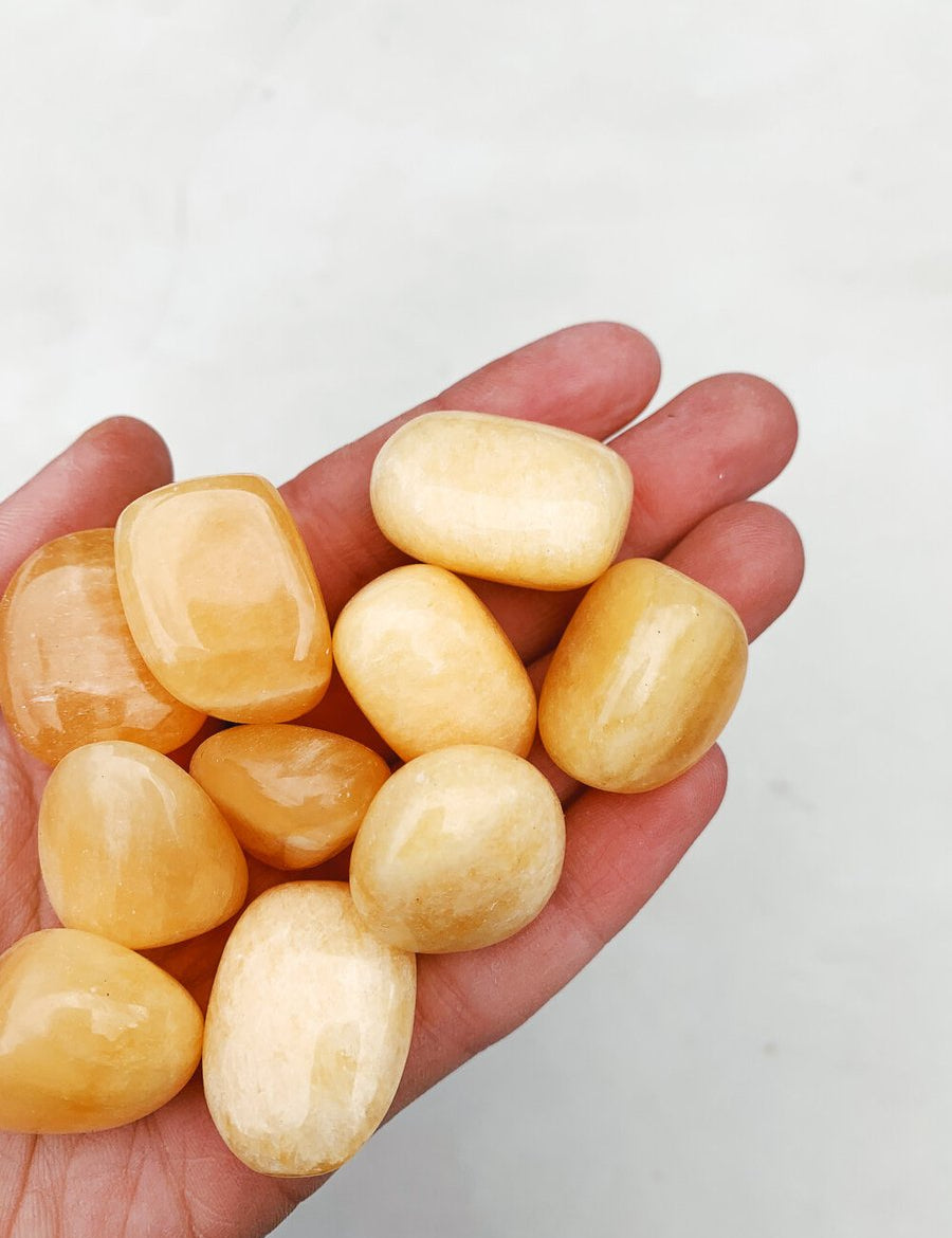 CLEANSE & CO. Orange Calcite. Ethically Sourced Tumbled Crystal.
