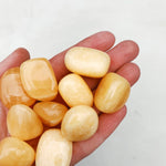 CLEANSE & CO. Orange Calcite. Ethically Sourced Tumbled Crystal.