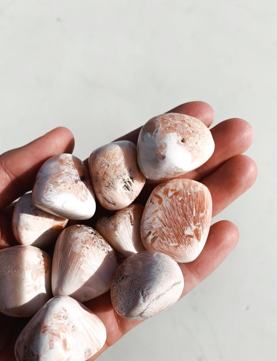 CLEANSE & CO. Pink Scolecite. Ethically Sourced Tumbled Crystal.