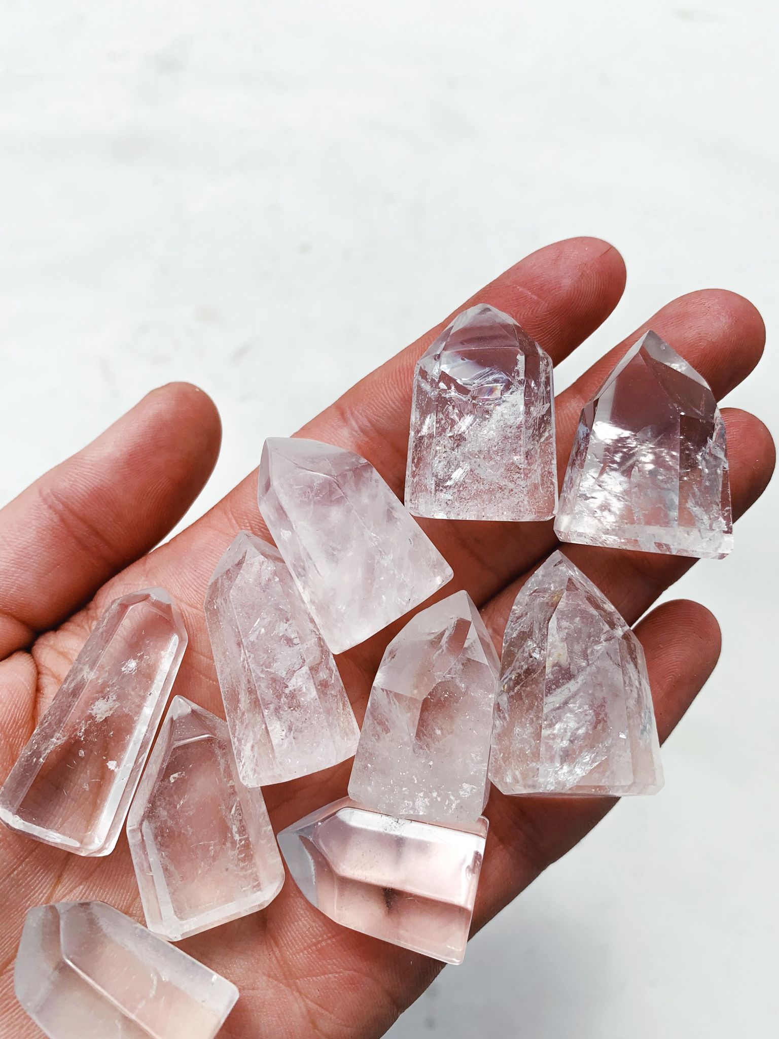 Mini Clear Quartz Tower on palm